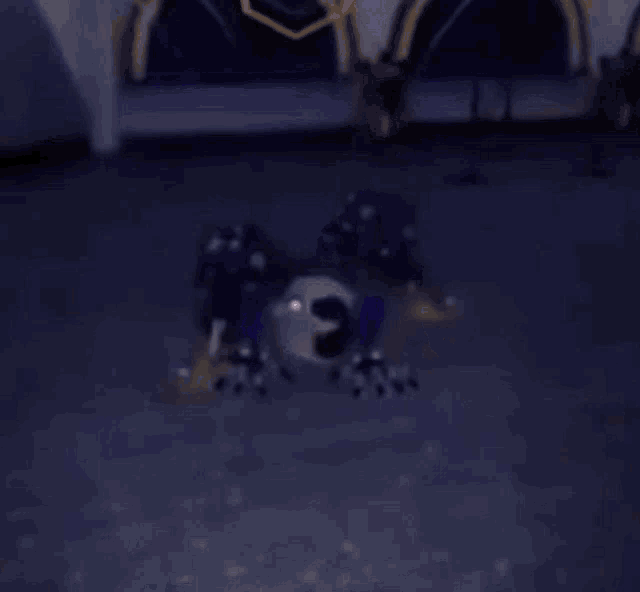 a stuffed animal is laying on its back on the floor .