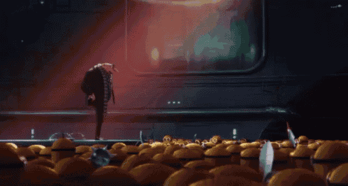 a cartoon character is standing in front of a bunch of minions on a stage .