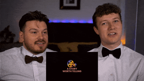 two men in bow ties are looking at a story worth telling
