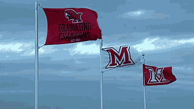 a graduates champions flag is flying in the wind
