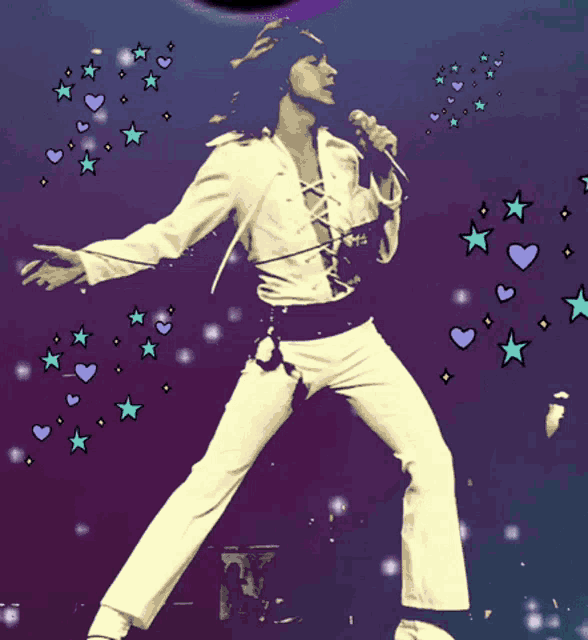 a man is singing into a microphone with hearts and stars around him