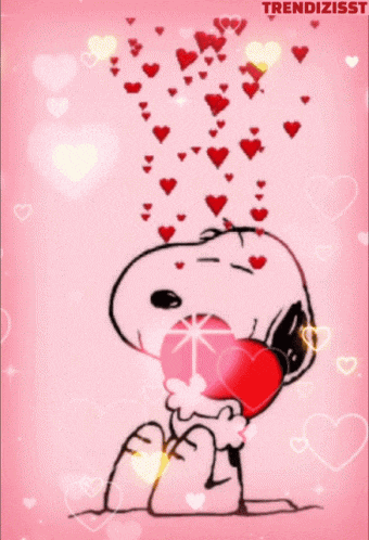 a cartoon of snoopy holding a heart with hearts falling out of his mouth