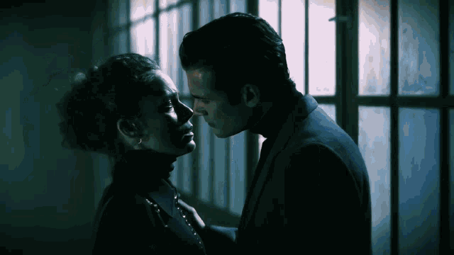 a man and a woman are looking into each others eyes