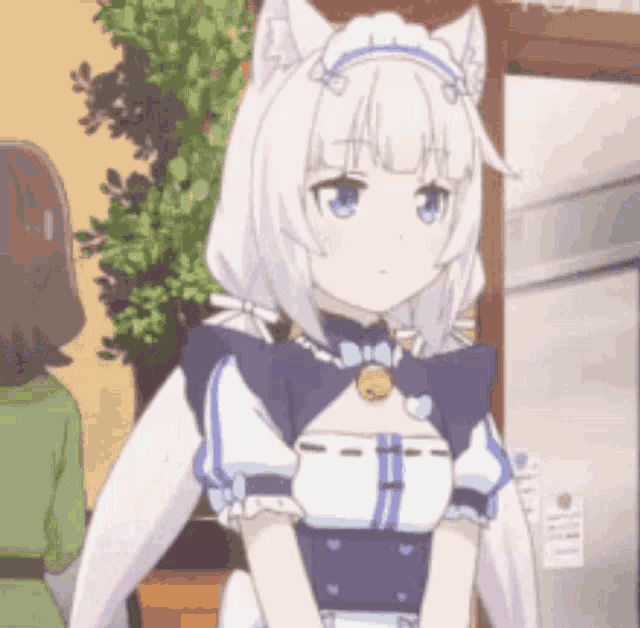 a girl with white hair and cat ears is wearing a maid outfit and standing in a room .