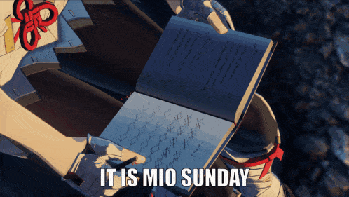a person holding a notebook that says it is mio sunday on it
