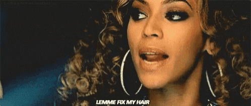a close up of a woman 's face with the words " lemme fix my hair " written on the bottom .