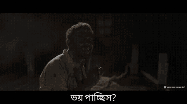 a man is crying in a dark room with a caption that says ' a ' on it