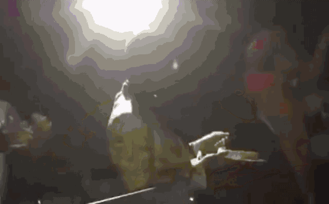 a person in a mask is playing a violin in a dark room