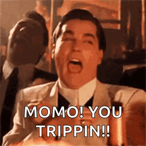 a man in a suit and tie is shouting momo you trippin !