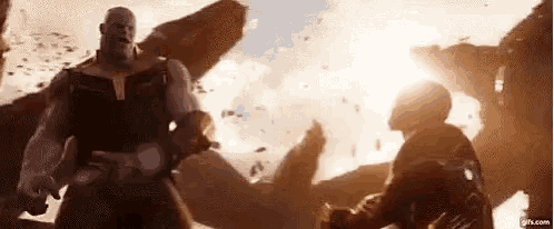 avengers infinity war thanos and iron man are fighting each other in a battle .