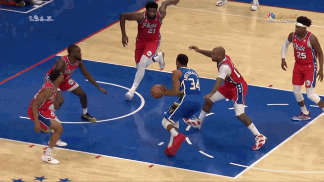 a philadelphia basketball game is being played on a court