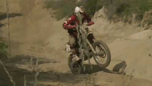 a person on a dirt bike with a husqvarna logo on their helmet