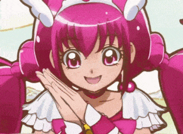 a close up of a pink anime character with a crown on her head