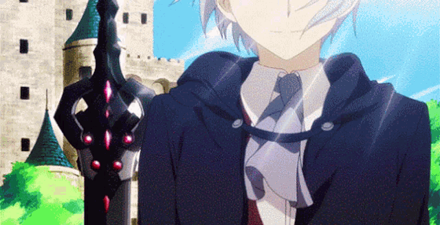 a young boy in a suit and tie is standing in front of a castle .