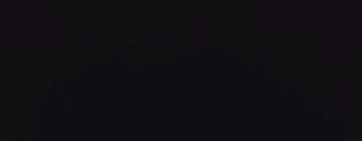 a dark background with a few white dots on it