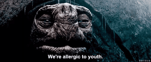 a close up of a person 's face with the words we 're allergic to youth