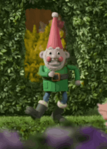 a cartoon gnome with a red hat and a green coat