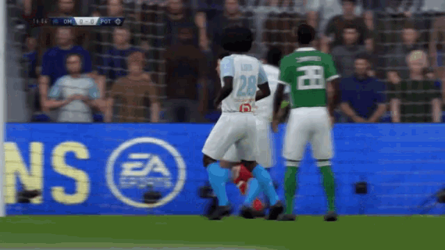 a soccer game is being played in front of an ea sports logo