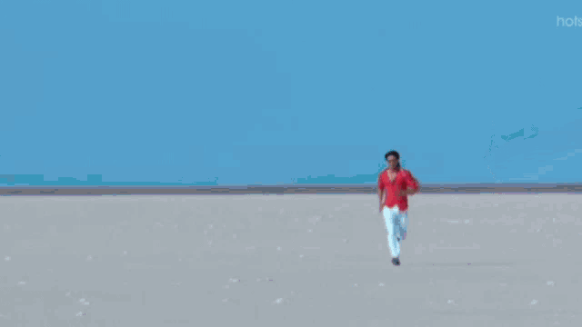 a man and a woman are dancing together in the desert .