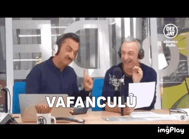 two men wearing headphones are sitting in front of a microphone with the words vafanculu written on the bottom