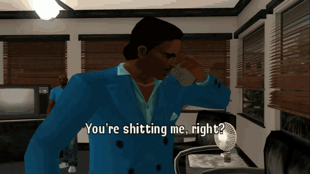 a man in a blue suit is talking on a cell phone with the words you 're shitting me right below him