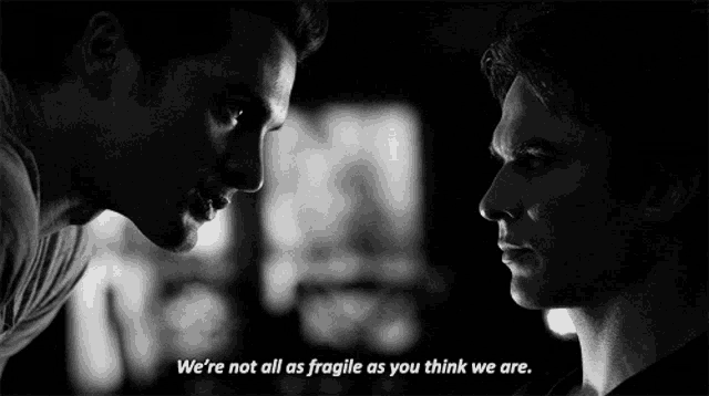 a black and white photo of two men looking at each other with the caption " we 're not all as fragile as you think we are