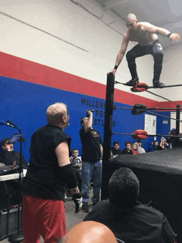 a wrestling ring with a blue wall that says millennium pro wrestling on it