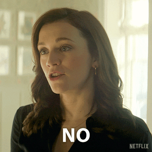 a woman says no in front of a netflix ad