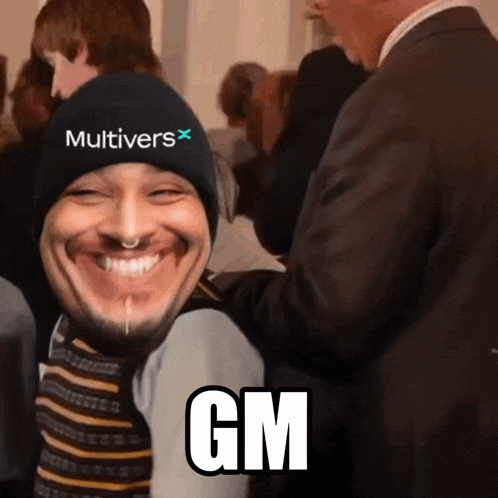 a man wearing a hat that says multivers gm