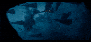 a group of ships are floating in the water