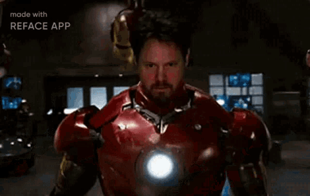 a close up of a person wearing a iron man helmet .