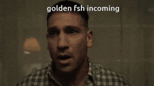 a man in a plaid shirt is crying with the words goldenfsh incoming written above him