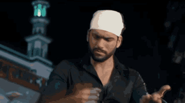 a man with a bandaged head is holding a rope .