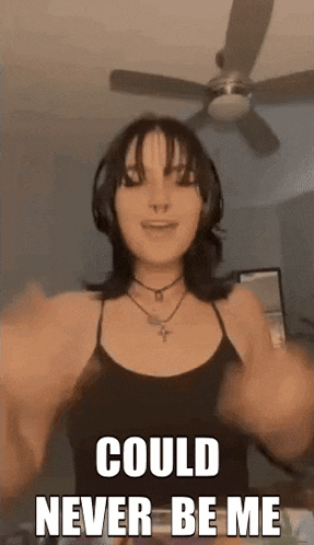 a woman wearing headphones is standing in front of a ceiling fan with the words `` could never be me '' .