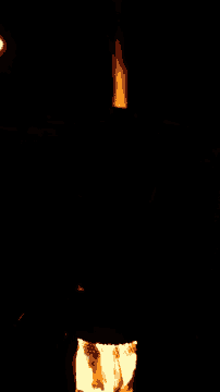 a dark room with a light coming out of the bottom right corner