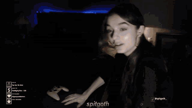 a girl is playing a video game with the name spitgoth on the bottom