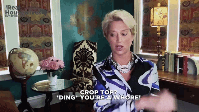 a woman says " crop top ding you 're a whore " in front of a globe