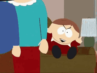 a cartoon character from south park is sitting on a couch giving the middle finger