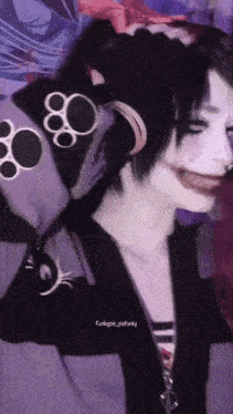 a girl in a joker costume is wearing headphones and a purple shirt