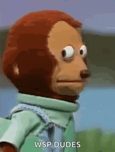 a monkey with big eyes is wearing a green shirt and says wsp dudes