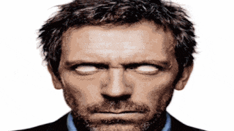 a close up of a man 's face with glowing white eyes