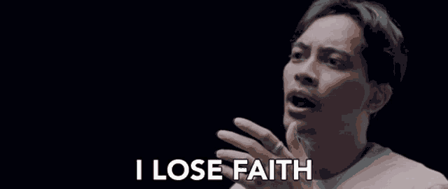 a man is smiling and saying `` i lose faith '' .