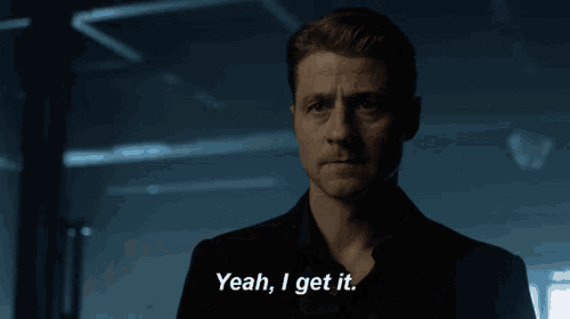a man says " yeah i get it " in a dark room