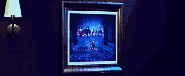 a framed painting of a group of people in a forest