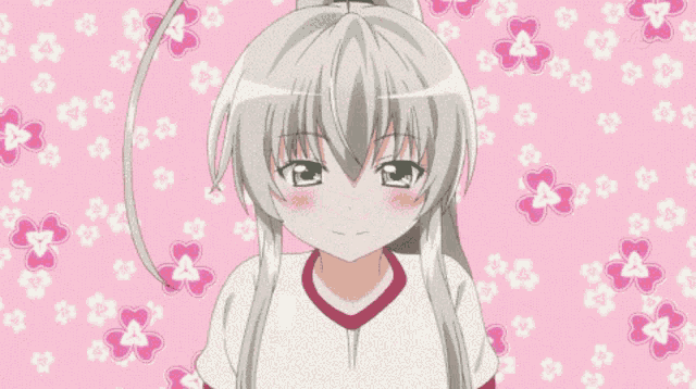 a girl in a white shirt with a red stripe on the sleeves is hugging herself