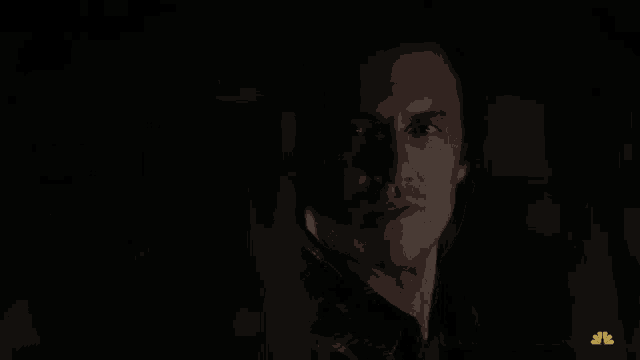 a man in a dark room with the words feel like i 'm home