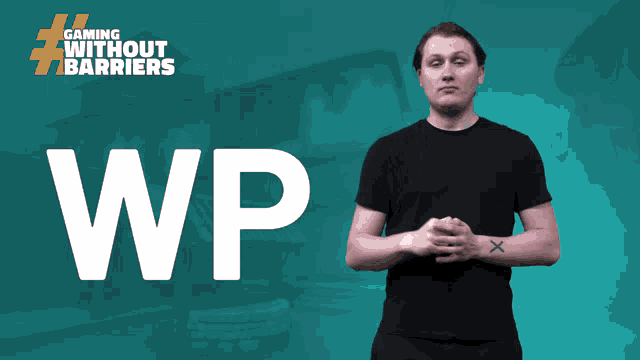 a man in a black shirt stands in front of a blue background that says gaming without barriers