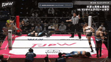 two women are wrestling in a ring that says tjpw on it
