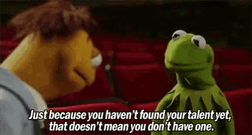 kermit the frog is talking to mr. snoopy in a movie theater .