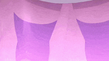 a close up of a person 's hand with a purple glove on it